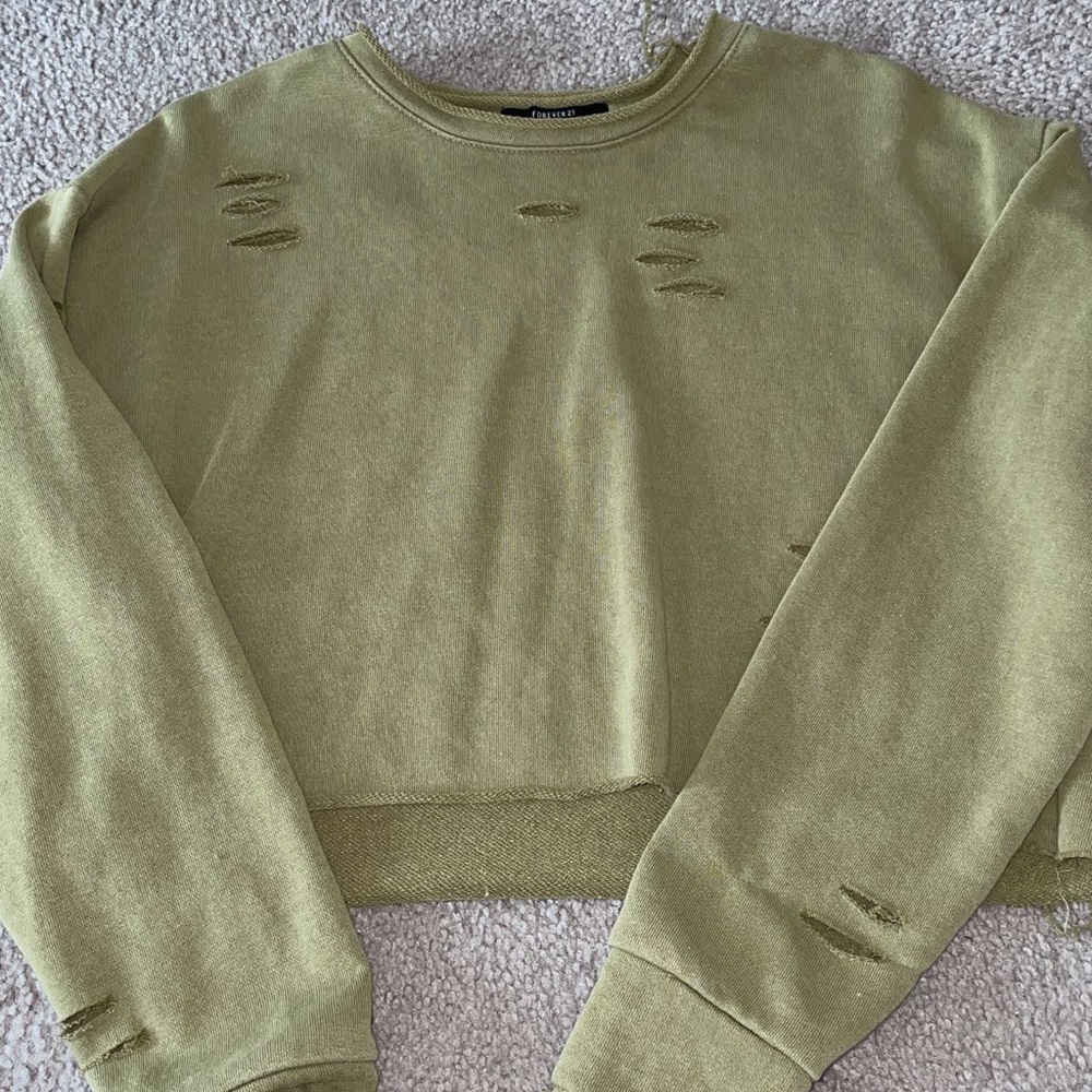 Ripped long sleeve sweater.